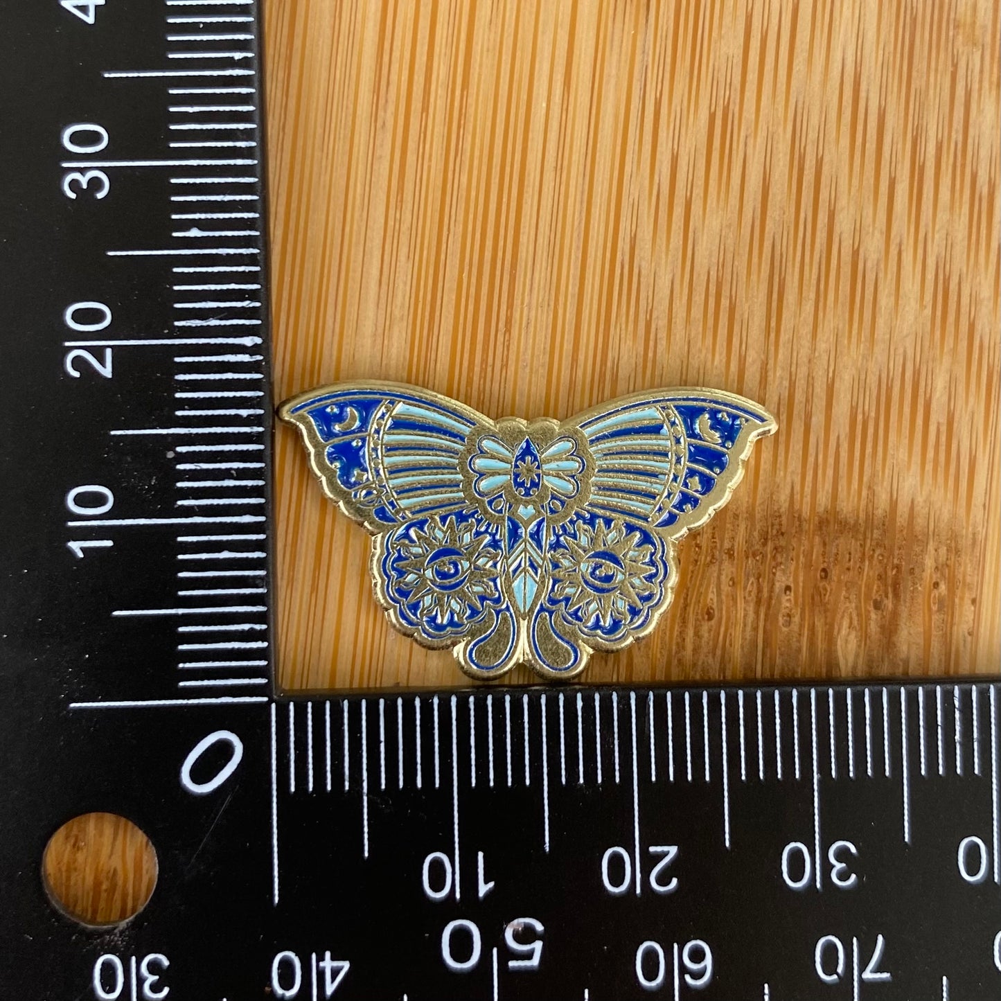 Blue Sun Eyes Moth Needle Minder